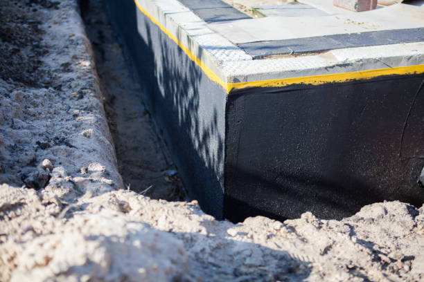 Professional Basement Waterproofing technician working in Carver, MN
